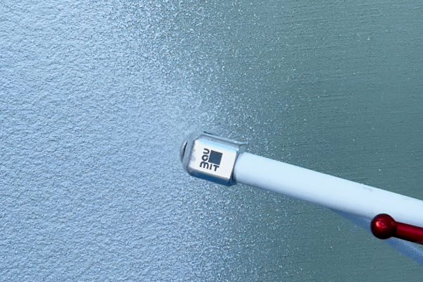 Nanášanie omietky Baumit SilikonTop Master striekaním